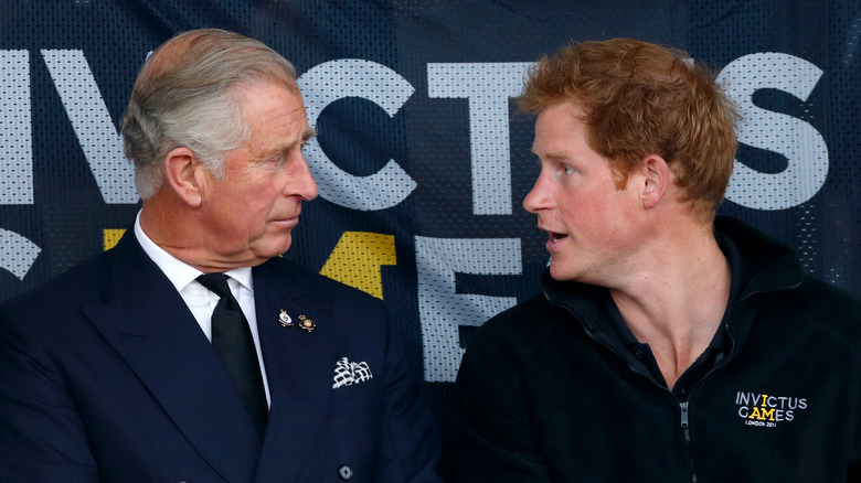 Prince Harry regards his father confusedly