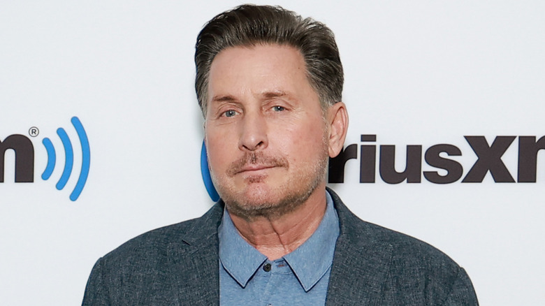 Emilio Estevez smirking