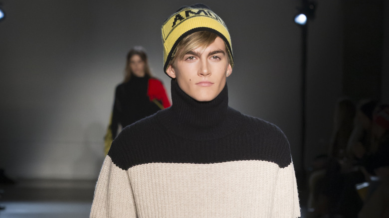 Presley Gerber wearing turtleneck and beanie