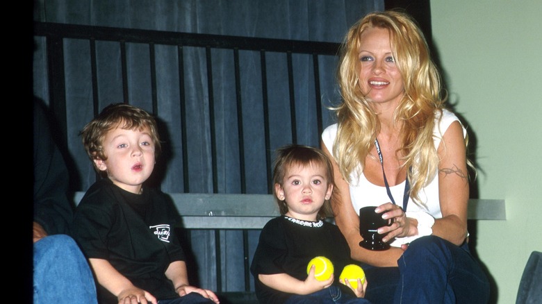 Pamela Anderson with her two small sons, smiling