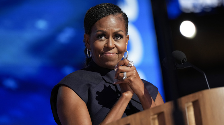 Closeup of Michelle Obama standing on podium in front of mic