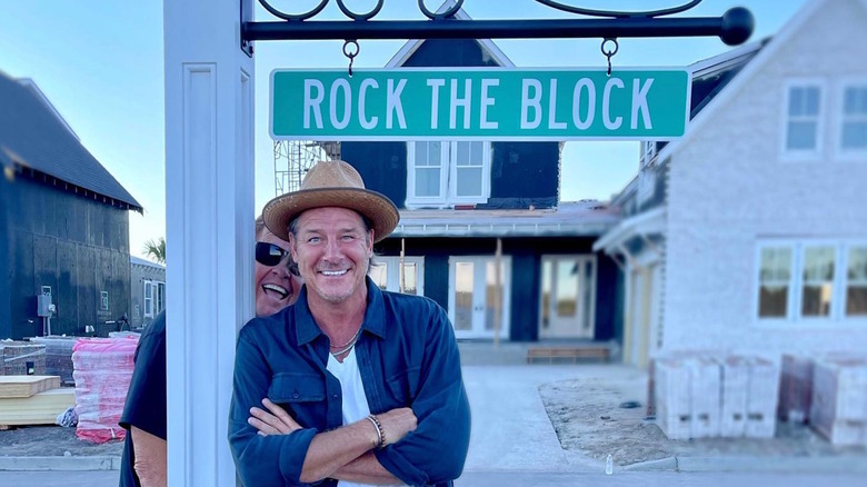 Ty Pennington with a Rock the Block sign