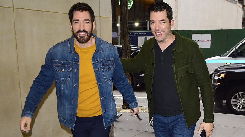 Drew and Jonathan Scott walking outside