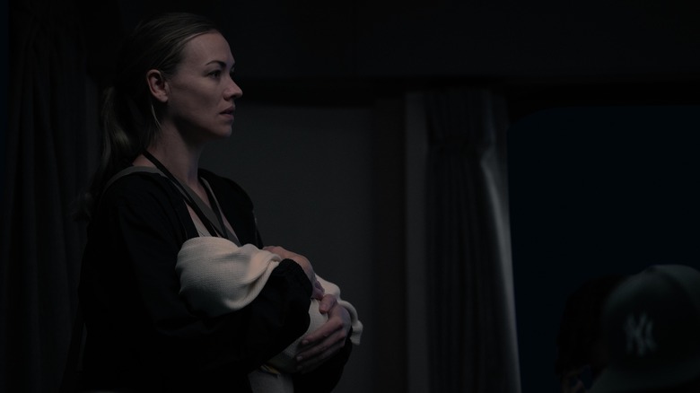 Serena holding baby in The Handmaid's Tale