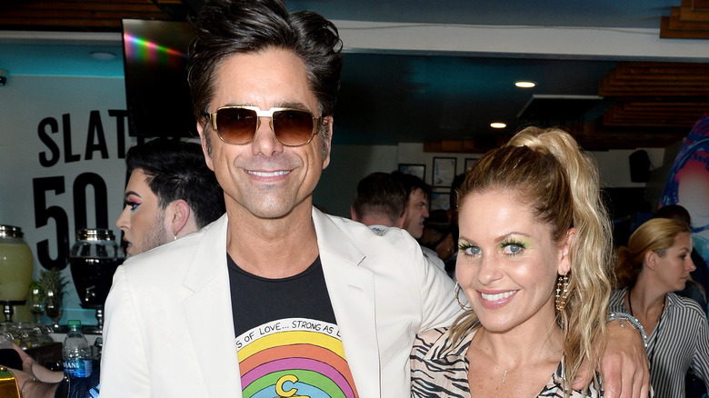 Candace Cameron Bure and John Stamos at an event. 