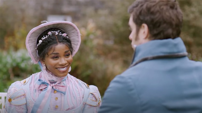 Deborah Ayorinde smiling at Edward Ferrars