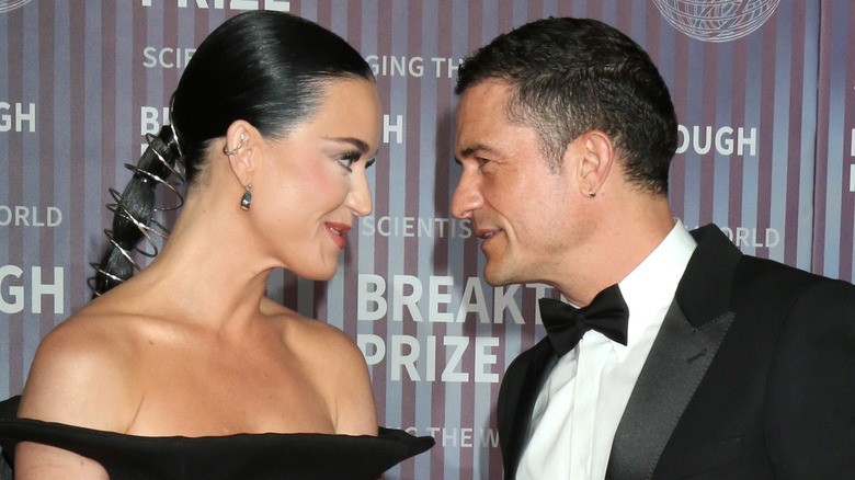 Katy Perry and Orlando Bloom looking at each other