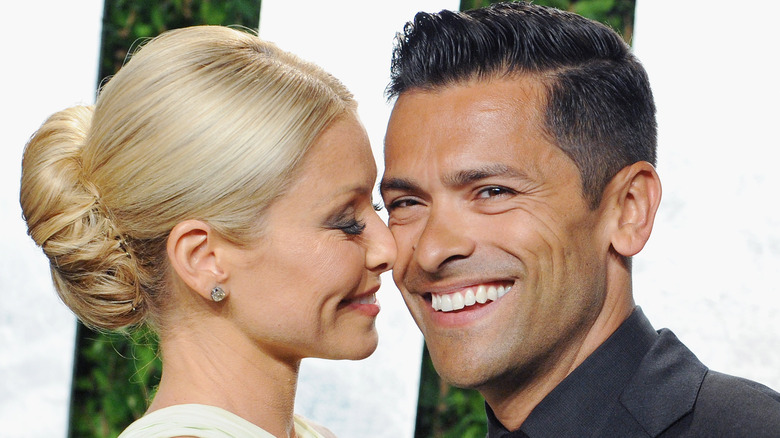 Kelly Ripa smiling into Mark Consuelo