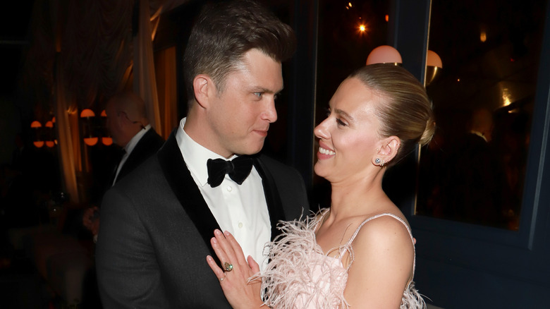 Colin Jost and Scarlett Johansson gazing at each other