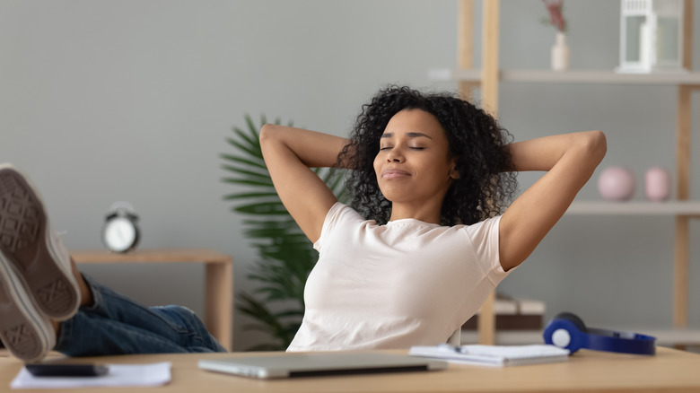 Woman relaxing and looking content