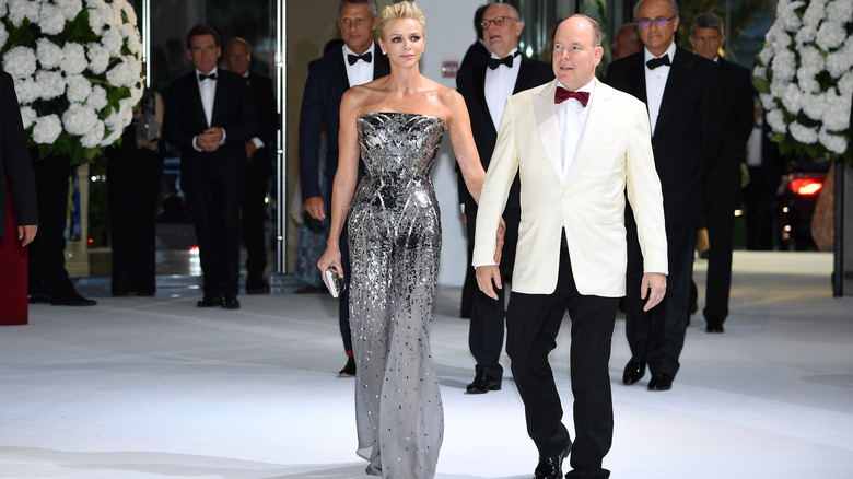 Princess Charlene and Prince Albert walking