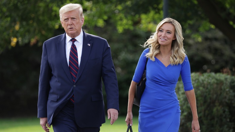 Kayleigh McEnany and Donald Trump walking together