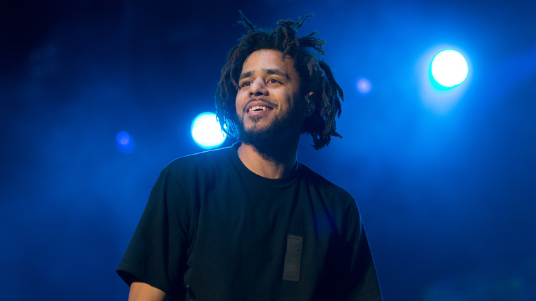 J. Cole performing on stage 