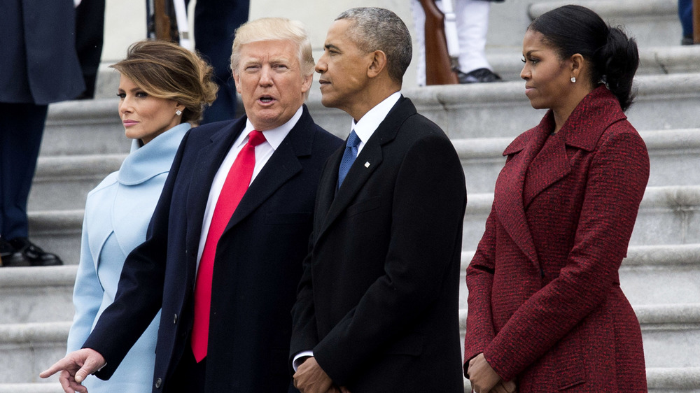 Melania and Donald Trump, Barack and Michelle Obama, all looking serious