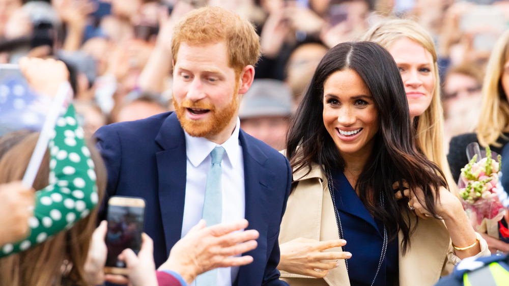 Meghan and Harry get swarmed by fans