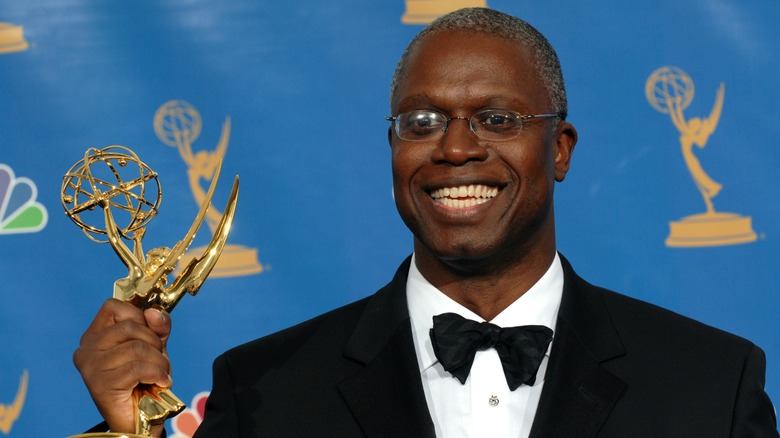 Andre Braugher smiling with his Emmy