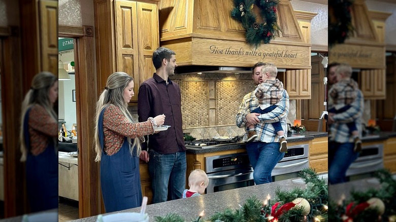 Jill and Derick Dillard and Jedidiah Duggar in kitchen Christmas