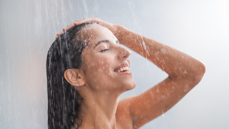 Woman rinsing hair