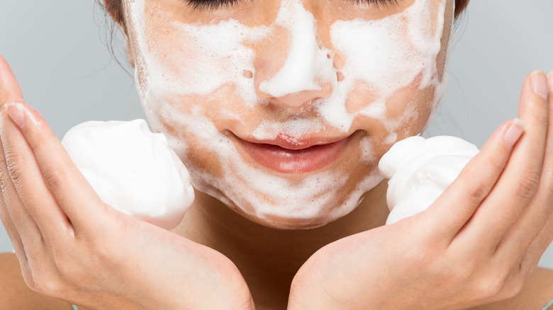 Woman washing face