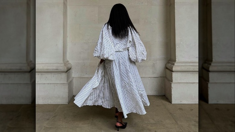 Back of person in dress and black heels