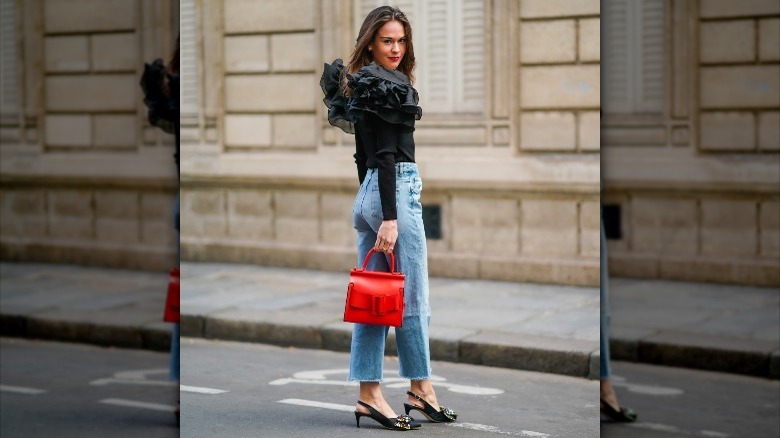 Woman posing on the street in kitten heels