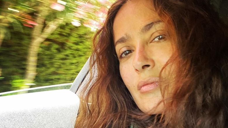 Salma Hayek taking a selfie in a car