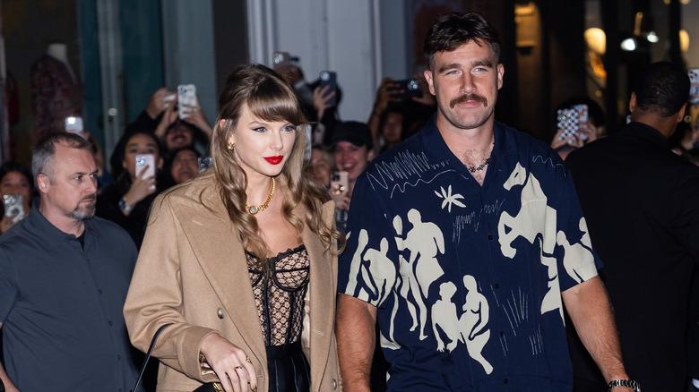 Travis Kelce and Taylor Swift walking