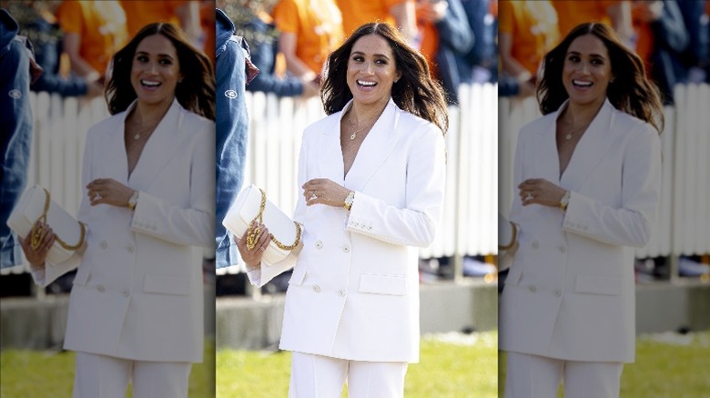 Meghan Markle wearing a gold Cartier watch