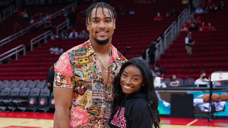 Jonathan Owens and Simone Biles posing 