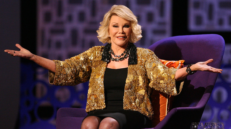 Joan Rivers with arms outstretched