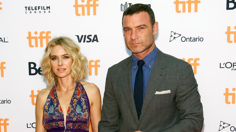 Naomi Watts smiling alongside Liev Schreiber.