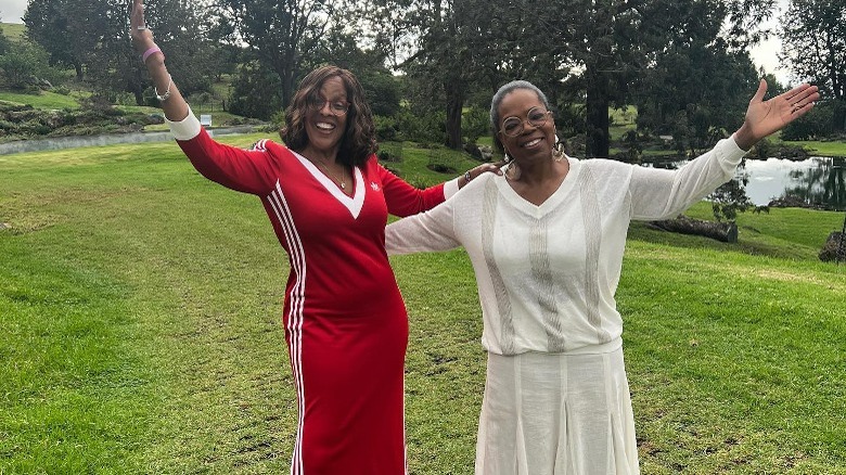 Gayle King and Oprah Winfrey smiling