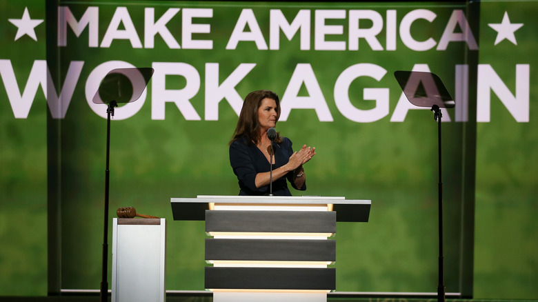 Kimberlin Brown clapping at podium