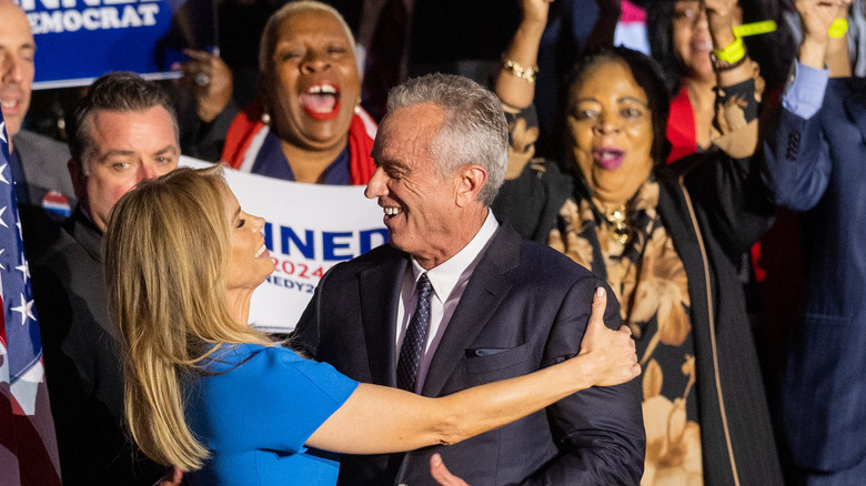 Cheryl Hines hugging Robert Kennedy Jr.