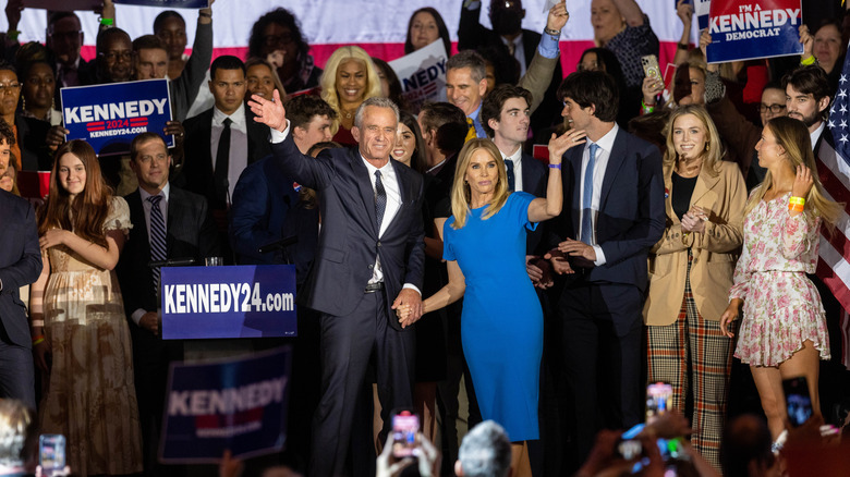 Robert Kennedy Jr. and Cheryl Hines waving