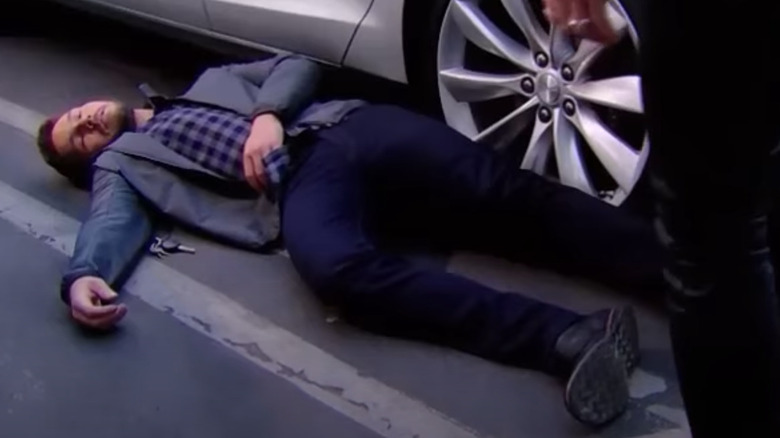 Liam laying on the ground unconscious