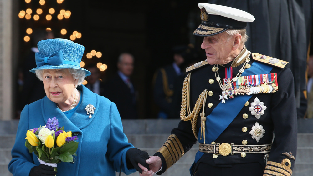 Queen Elizabeth and Prince Philip walking