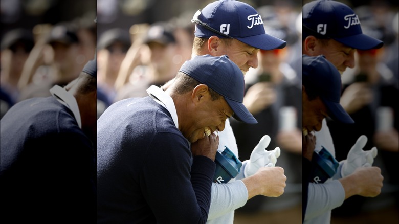 Justin Thomas and Tiger Woods laughing