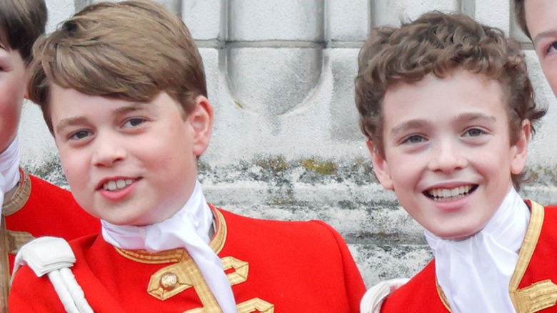 Prince George smiling with Lord Oliver