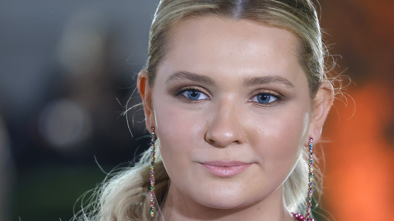 Abigail Breslin wearing drop earrings