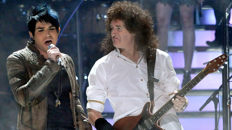 Adam Lambert performing with Brian May