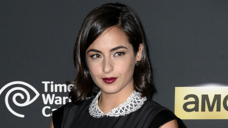 Alanna Masterson with short hair and red lipstick