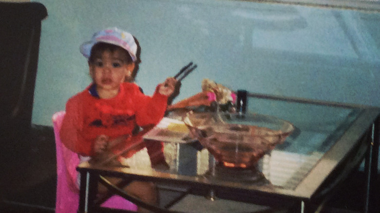 Alexandria Ocasio-Cortez as a little kid eating