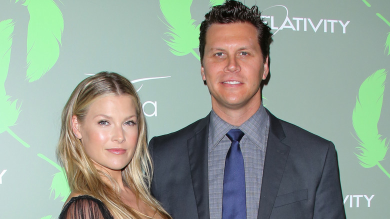 Ali Larter and Hayes MacArthur posing at a gala