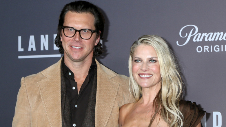 Ali Larter and Hayes MacArthur smiling at a premiere