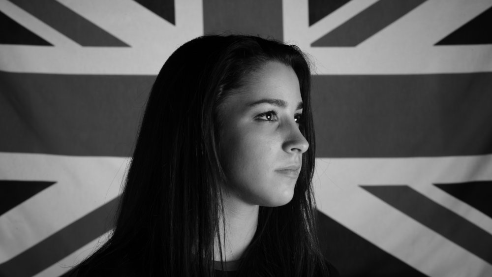 Aly Raisman in front of the British flag in 2011