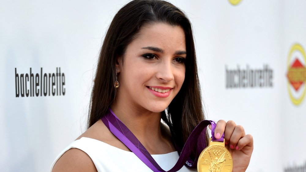 Aly Raisman with her Olympic medal in 2012