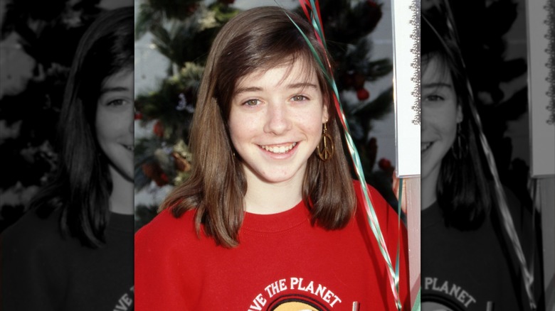 Alyson Hannigan as a kid smiling