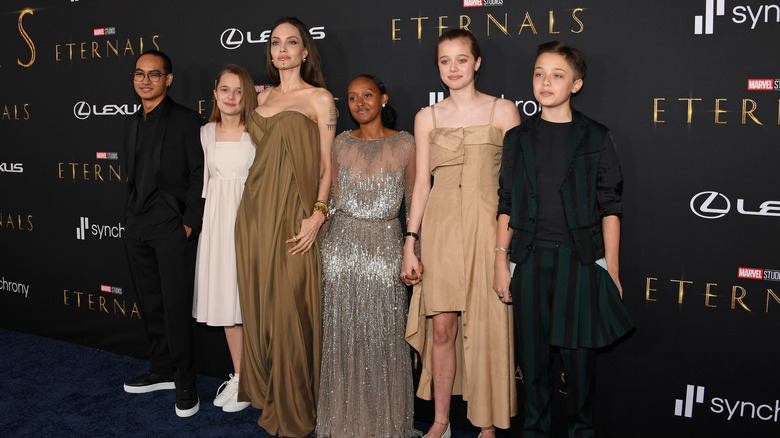 Angelina Jolie and her kids posing on the red carpet