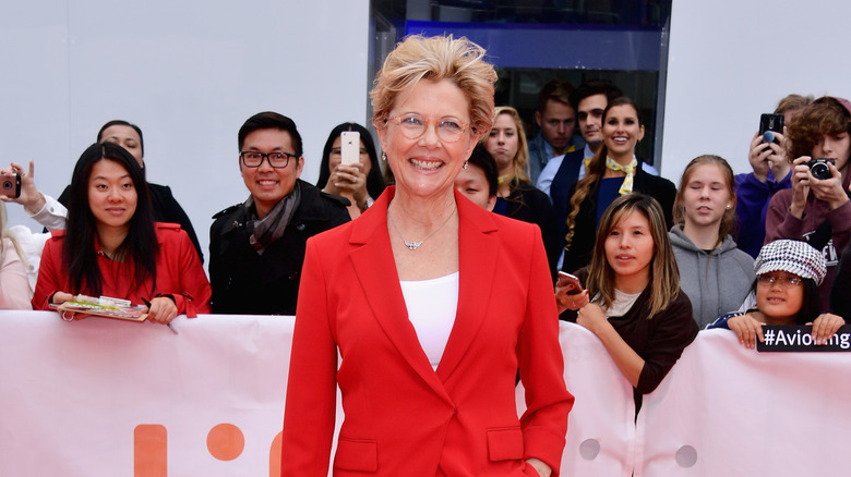 Annette Bening wearing red suit